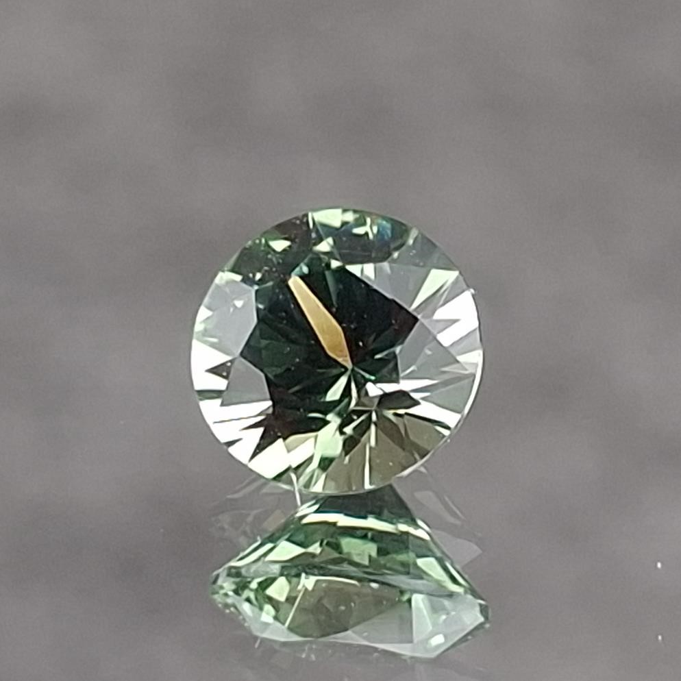 0.63 ct. Greenish Yellow Round Montana Sapphire